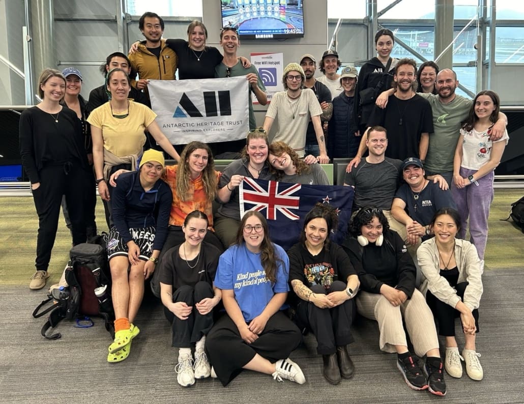 People posing for a group photo at an airport. Keywords: Antarctic Heritage Trust Inspiring Explorers Expedition South Georgia Santiago Airport